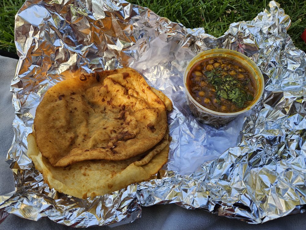 Indian flatbread served with a side of curry.