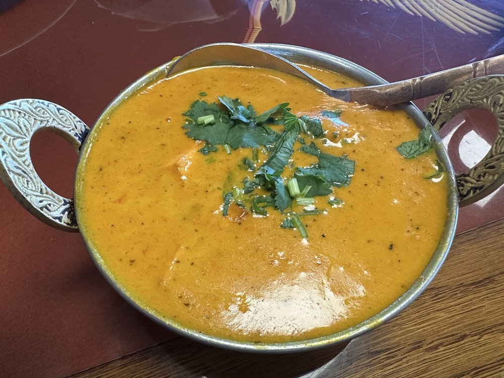 Rich chicken tikka masala curry in a bowl.