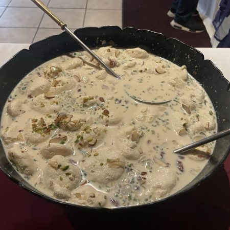 White creamy yogurt raita dish inside a large cooking pot.